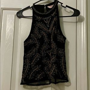 Black top with gold embroidered leaves